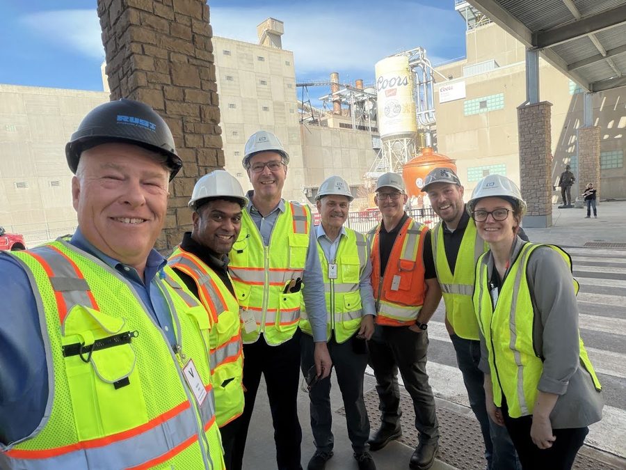 Members of the Rust team in hard hats and high-visibility vests on an industrial site